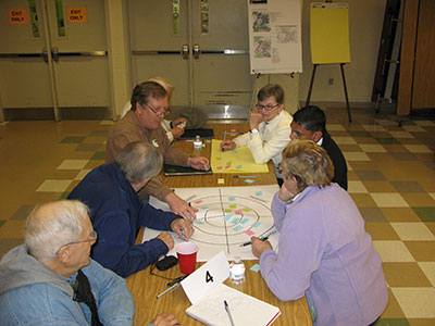 Participants share ideas about the Ten Mile Creek Limited Amendment at the November community meeting.