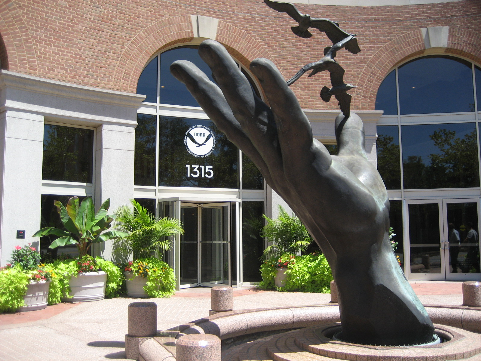 "The Hand" by Ray Kaskey, 1993; 1315 East West Hwy & Colesville Road; Bronze sculpture/fountain 12ftH by 18ftW.