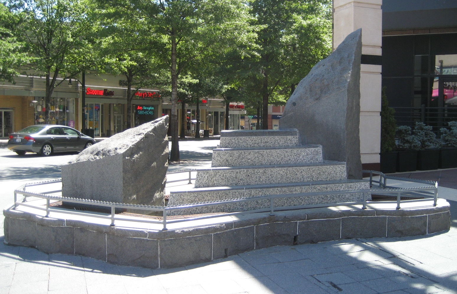 "City Place Bench" by Richard Hansen, 1992; 8661 Colesville Road and Fenton Street; Granite mica schist, blue pearl schist, aluminum; 8ft by18ft by 8ft.