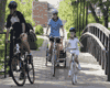 photo - riders crossing a bridge